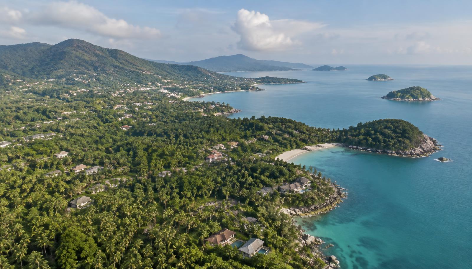 Wide aerial view of the north-east coast of Koh Samui, with headlands and small islands.